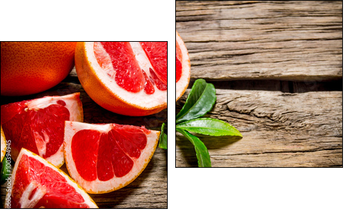 Fresh cut grapefruit with leaves. On wooden table. - Two-piece canvas print, Diptych