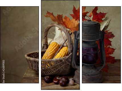 Herbstliches Stilleben mit Petroleumlampe und Mais in Weidenkorb - Three-piece canvas print, Triptych