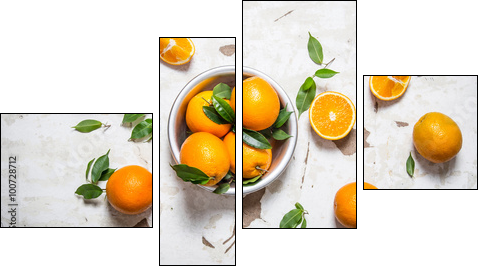 Orange style. Fresh oranges with leaves in a Cup . - Four-piece canvas print, Fortyk