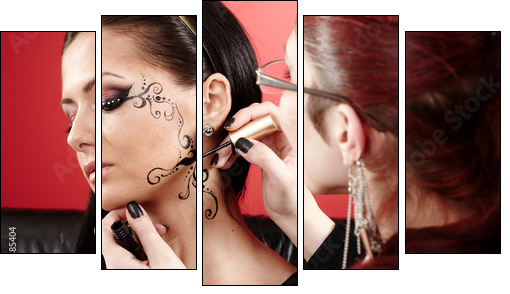 Brunette having applied face tattoo by makeup artist - Five-piece canvas print, Pentaptych