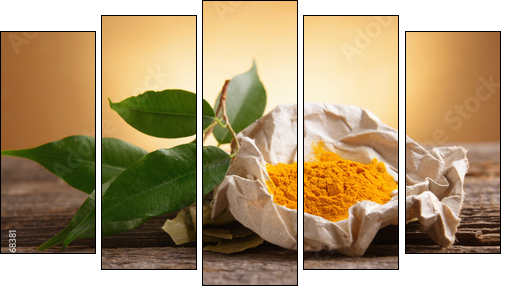 Tumeric powwder spice on wooden board with fresh leaves - Five-piece canvas print, Pentaptych